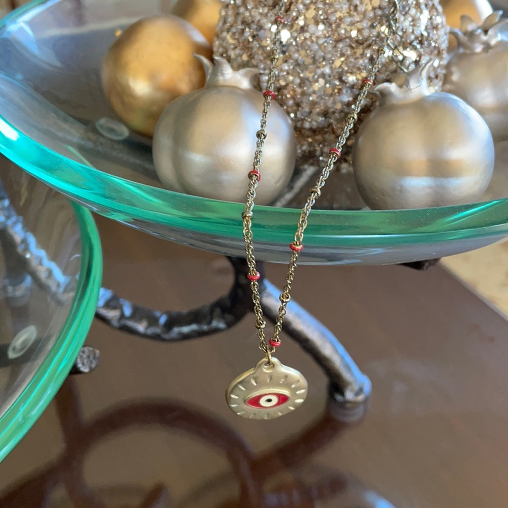 Necklace with red eye.